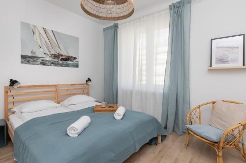 Posteľ alebo postele v izbe v ubytovaní Marina Corner Apartment Gdynia by Noclegi Renters