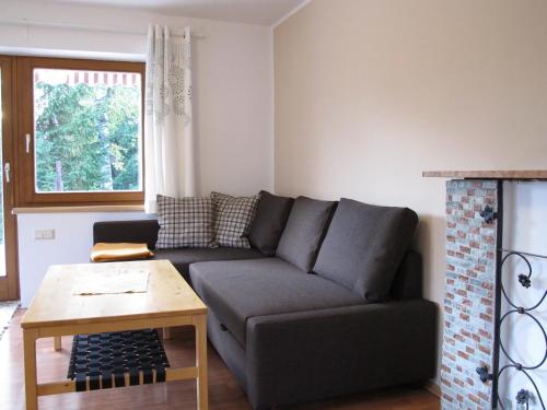 a living room with a couch and a table at Apartement Gute Laune in Mieming