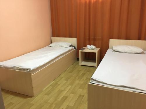 Кровать или кровати в номере Гостиница"Hostel"