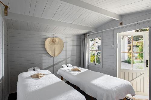 Postel nebo postele na pokoji v ubytování Shtarkman Erna Boutique Hotel Nahariya