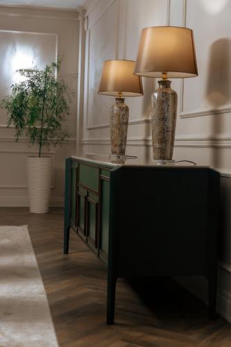two lamps on a table in a room at Medeu in Kostanay