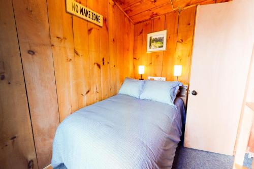 Voodi või voodid majutusasutuse Lake Cottage toas