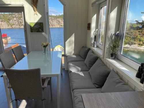 a living room with a couch and a table at 6 person holiday home in Urangsvåg-By Traum in Ervik