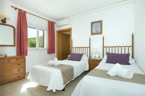 Postel nebo postele na pokoji v ubytování Villa Illa Petita by Villa Plus