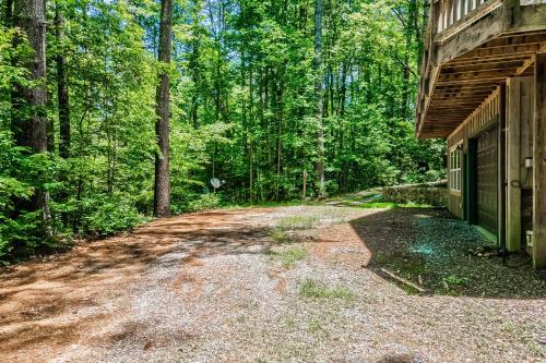 a dirt road next to a building in the woods at Osprey Landing in Clarkesville
