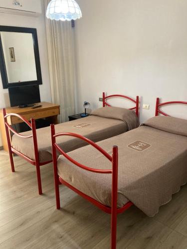 Letto o letti in una camera di Hotel L'Ancora