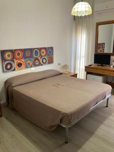 Letto o letti in una camera di Hotel L'Ancora