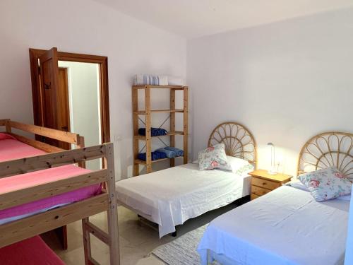 Krevet ili kreveti na kat u jedinici u objektu Prime Homes- San Miguel Golf,Ocean Front Bungalow