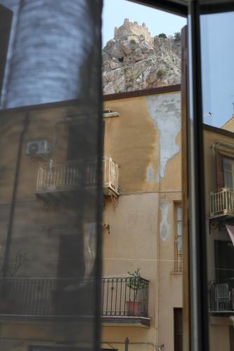 a view of a building from a window at Suite Garibaldi in Cefalù