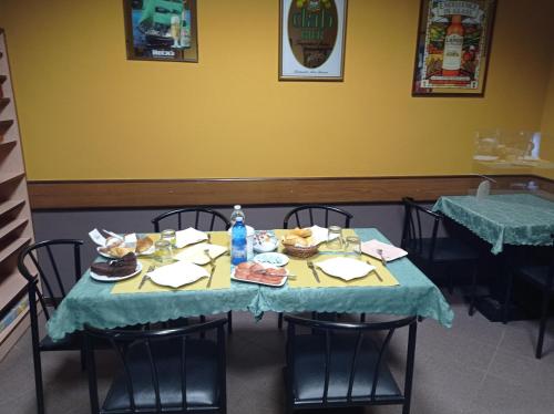 a dining room with a table with food on it at Lo Zodiaco in Roncobillaccio