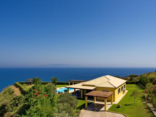 a house with a view of the ocean at Villa Hephaestus Spartia Kefalonia in Spartia