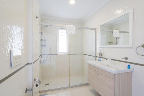 a bathroom with a shower and a sink at Ada Villas in Kusadası