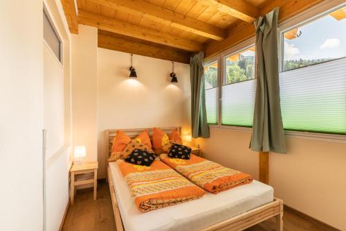 Ένα ή περισσότερα κρεβάτια σε δωμάτιο στο K2 Brunnen Haus
