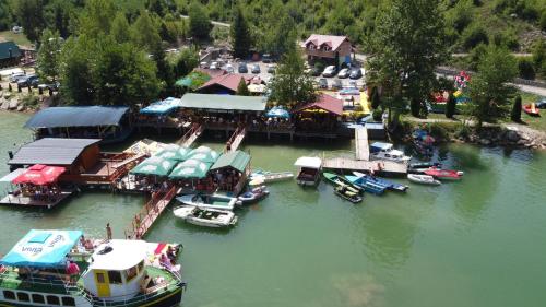 an aerial view of a marina with boats in the water at Kućica na Drini "JAZ" in Višegrad