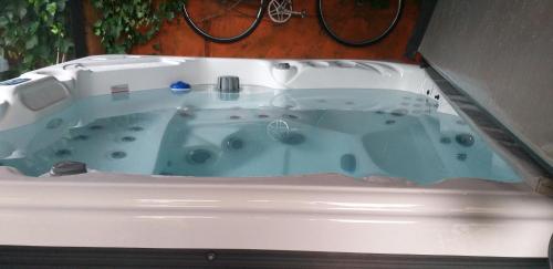 a bath tub in the corner of a room at Páteo memória, casa do beco in Setúbal