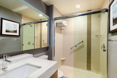 a bathroom with a sink and a glass shower at Hyatt Place Moab in Moab