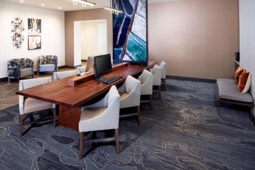 a conference room with a wooden table and chairs at Hyatt Place Moab in Moab