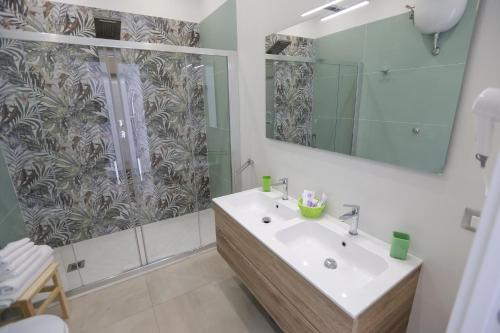 a bathroom with a sink and a shower at M'incanto B&B in Naples