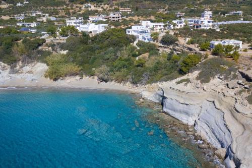 an aerial view of a beach with white houses at Porto Belissario in Ferma