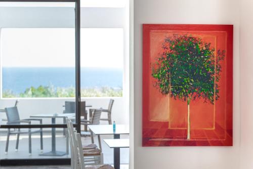 a painting of a tree in a room at Porto Belissario in Ferma