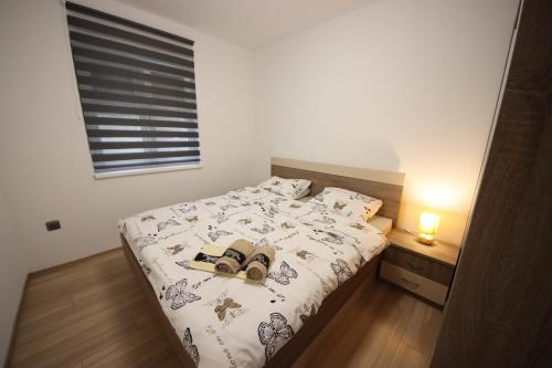 Postel nebo postele na pokoji v ubytování Apartmani Horvat