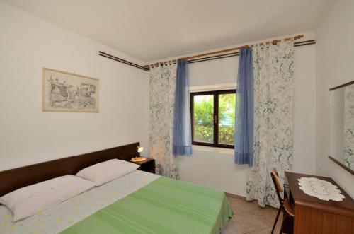 Postel nebo postele na pokoji v ubytování Apartment Luna