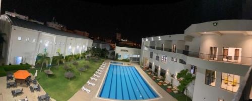 Piscina en o cerca de Eventi Club by cité des sports adarissa