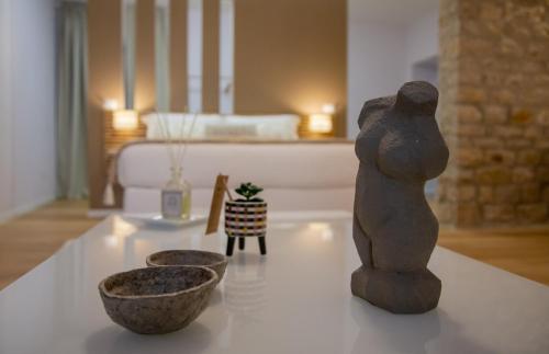 En eller flere senge i et værelse på La Piazzetta Suite