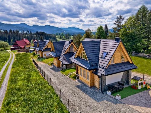 an overhead view of a row of log homes at Peak House in Kościelisko