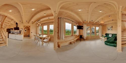 a circular house with a wooden ceiling at Peak House in Kościelisko