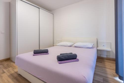 Posteľ alebo postele v izbe v ubytovaní Apartments Natalija