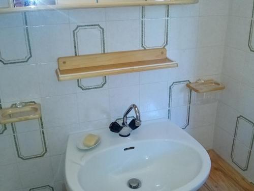 a bathroom with a white sink with a cup on it at Studio Corrençon-en-Vercors, 1 pièce, 4 personnes - FR-1-515-140 in Corrençon-en-Vercors