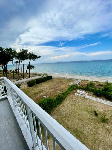 a balcony with a view of the ocean at CHANIOTH LUXURY SUITES BY MAKHOME in Hanioti