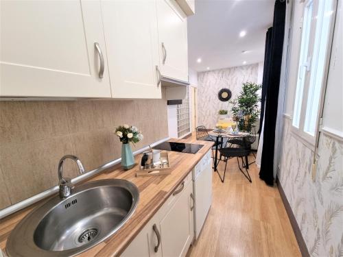 a kitchen with a sink and a counter top at MOLINA - LA LATINA in Madrid