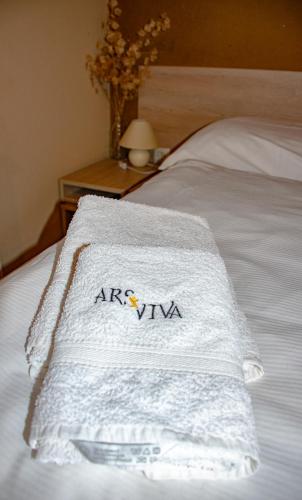 Ένα ή περισσότερα κρεβάτια σε δωμάτιο στο Youth Hostel Arsviva