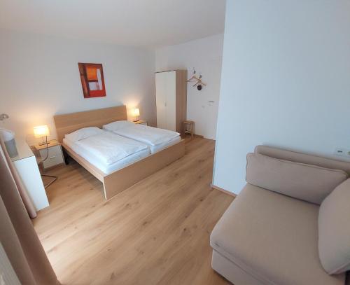 Postel nebo postele na pokoji v ubytování Ewitsch 13 - Hotel Garni