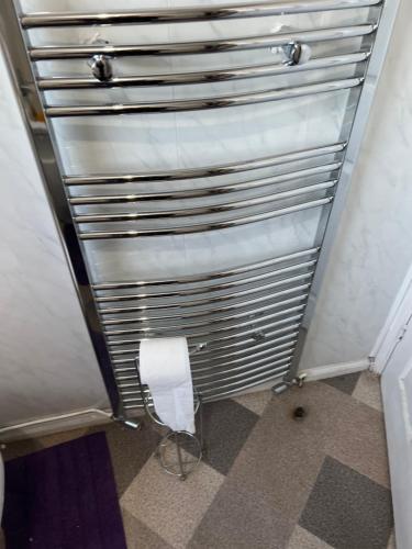 a roll of toilet paper in a bathroom stall at Luxury villa in Summerseat