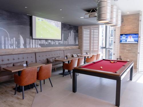 TV a/nebo společenská místnost v ubytování ibis Styles Dubai Deira