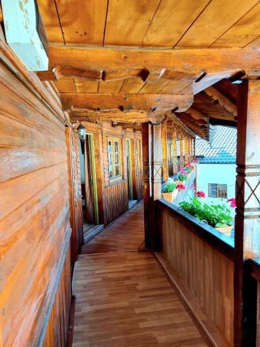 a hallway in a house with wooden walls at PENSIUNEA BOCA VORONET in Voronet