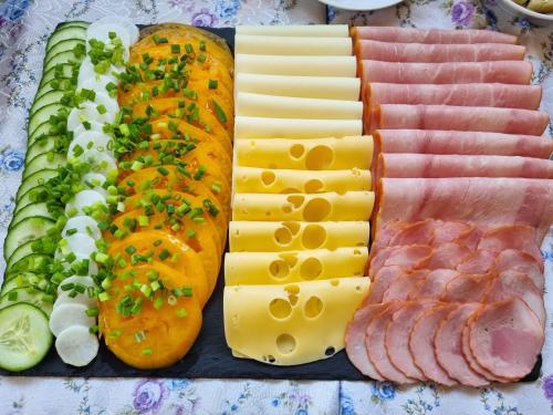 a tray of different types of meats and cheese at Przystanek Podgórze in Duszniki Zdrój