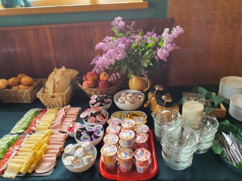 a table with appetizers and other food items on it at Przystanek Podgórze in Duszniki Zdrój