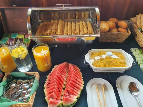 a buffet of food with fruit and other foods at Przystanek Podgórze in Duszniki Zdrój