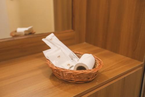 a basket of toilet paper sitting on a counter at VIPRA HOTEL in Coimbatore