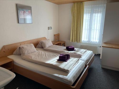 מיטה או מיטות בחדר ב-Lodge Bergrestaurant Kleine Scheidegg