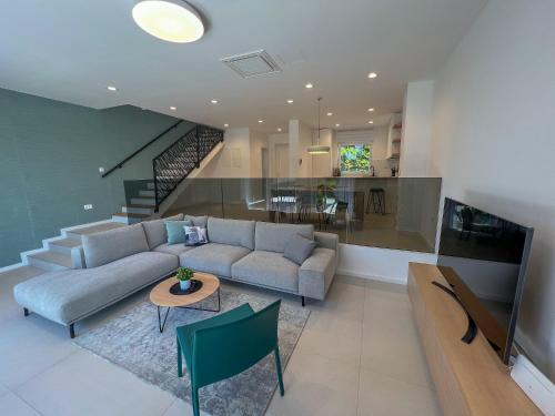 a living room with a couch and a table at Zadar Premium Apartments in Kožino