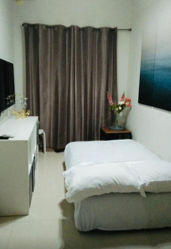 Postel nebo postele na pokoji v ubytování S Residences-MOA
