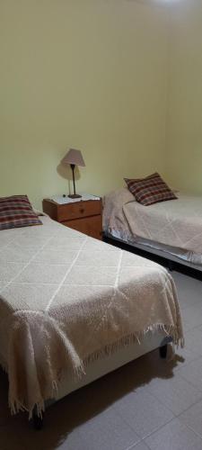 מיטה או מיטות בחדר ב-Casa con Piscina