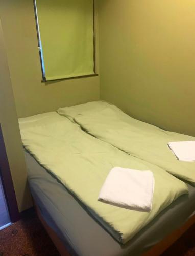 Posteľ alebo postele v izbe v ubytovaní Skipper Apartman