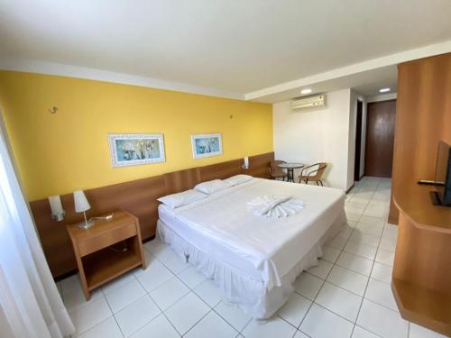 Uma cama ou camas num quarto em Ponta Negra Flat ByHotéis