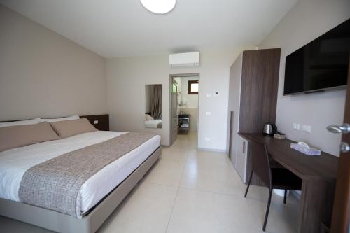 Postel nebo postele na pokoji v ubytování B&B” La Tezza”